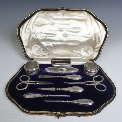 126 - A cased George V silver Manicure Set, by Walker & Hall, hallmarked Birmingham 1913, nine piece, ... 