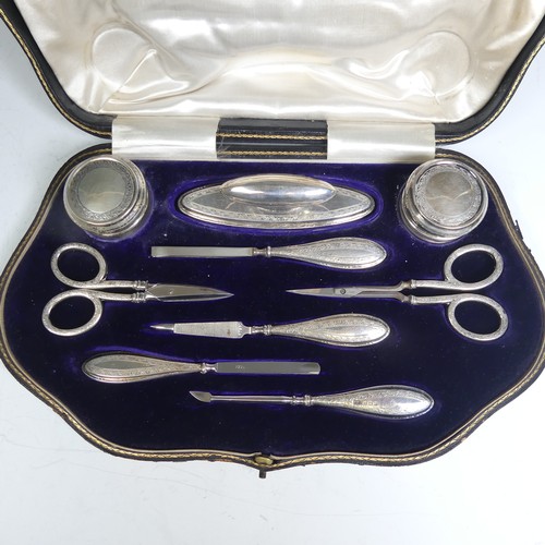 126 - A cased George V silver Manicure Set, by Walker & Hall, hallmarked Birmingham 1913, nine piece, ... 