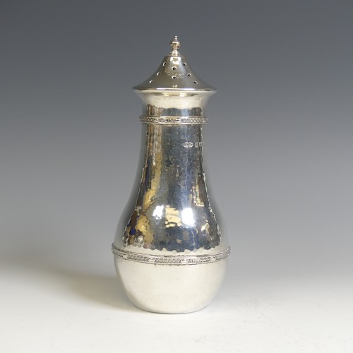 129 - A E Jones; A George V silver Sugar Caster, hallmarked Birmingham, 1920, in the Arts & Crafts sty... 