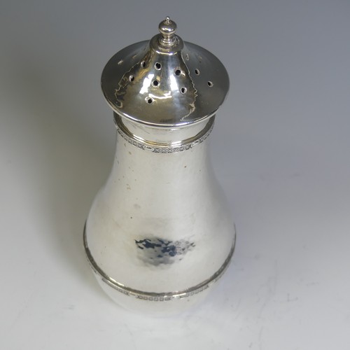 129 - A E Jones; A George V silver Sugar Caster, hallmarked Birmingham, 1920, in the Arts & Crafts sty... 