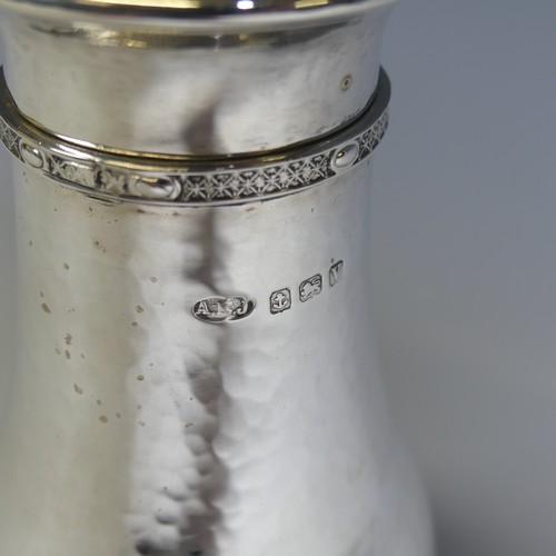 129 - A E Jones; A George V silver Sugar Caster, hallmarked Birmingham, 1920, in the Arts & Crafts sty... 