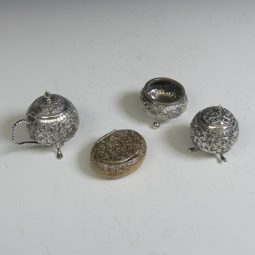 133 - An Indian silver three piece Cruet Set, of circular form with foliate decoration, the mustard with h... 