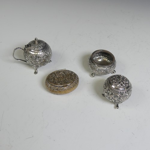 133 - An Indian silver three piece Cruet Set, of circular form with foliate decoration, the mustard with h... 