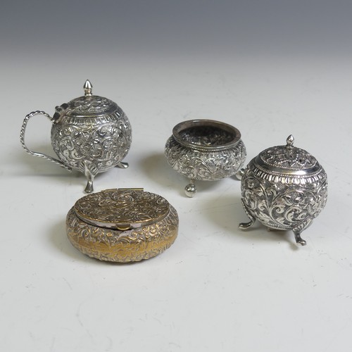 133 - An Indian silver three piece Cruet Set, of circular form with foliate decoration, the mustard with h... 