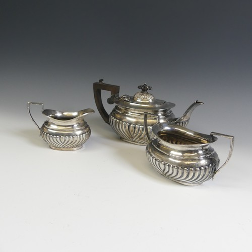 137 - An Edwardian silver three piece Tea Set, by W G Keight & Co., hallmarked Birmingham 1903, of ova... 