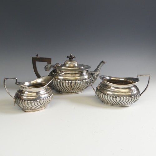 137 - An Edwardian silver three piece Tea Set, by W G Keight & Co., hallmarked Birmingham 1903, of ova... 