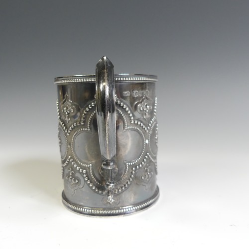 156 - A Victorian silver Christening Mug, by Henry Holland, hallmarked London 1870, in the Gothic style wi... 