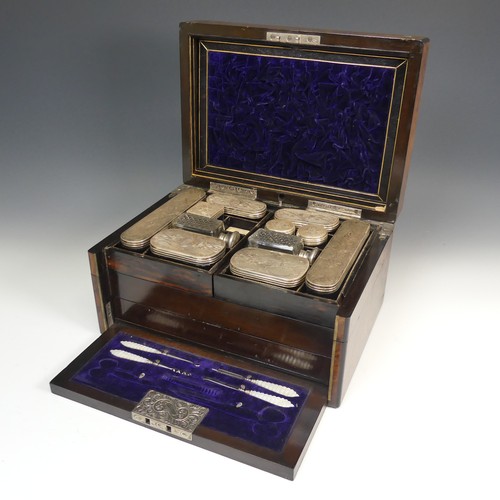 83 - A Victorian walnut Vanity Box, with silver plate mounted glass jars in fitted pivoting top trays, fi... 