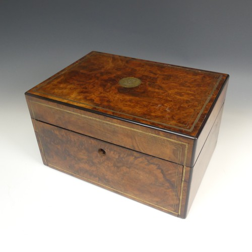 83 - A Victorian walnut Vanity Box, with silver plate mounted glass jars in fitted pivoting top trays, fi... 