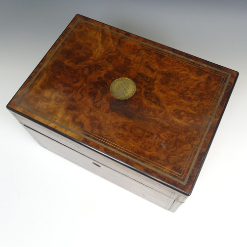 83 - A Victorian walnut Vanity Box, with silver plate mounted glass jars in fitted pivoting top trays, fi... 