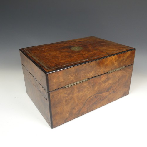 83 - A Victorian walnut Vanity Box, with silver plate mounted glass jars in fitted pivoting top trays, fi... 