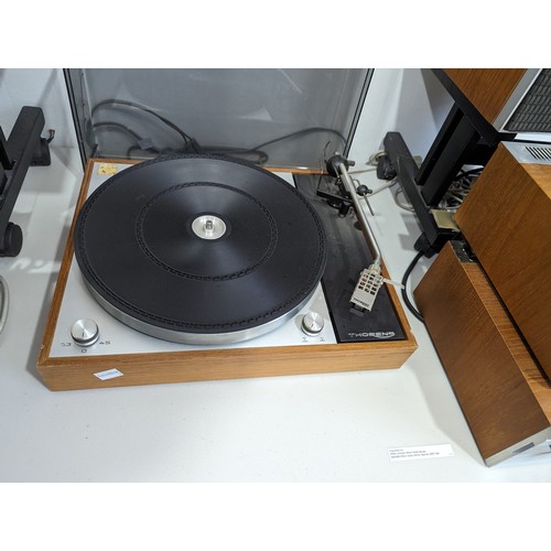 613 - A harlequin Hi-Fi system, comprising of ; A Thorens TD 150/11 Turntable, a Leak Delta AM.FM Tuner, a... 