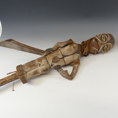 582 - Tribal art; an early 20th century Ogoni (Nigeria) wooden Puppet, with turning head, articulated arms... 