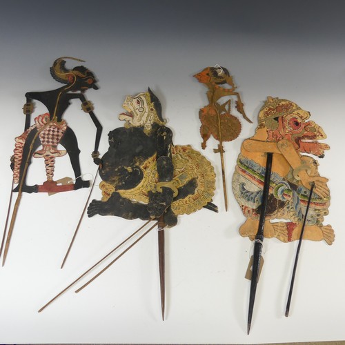 581A - Tribal art; four early 20th century Javanese Wayang Kulit (shadow puppets), formed of ornately paint... 