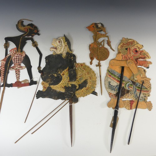 581A - Tribal art; four early 20th century Javanese Wayang Kulit (shadow puppets), formed of ornately paint... 