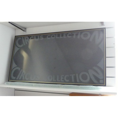 787 - A 'Circus Collection' wall-mounted glazed display cabinet, 56cm x 106cm, and another wall-mounted gl... 