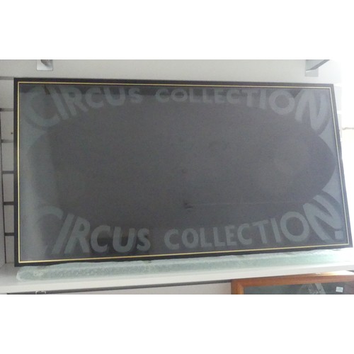 787 - A 'Circus Collection' wall-mounted glazed display cabinet, 56cm x 106cm, and another wall-mounted gl... 