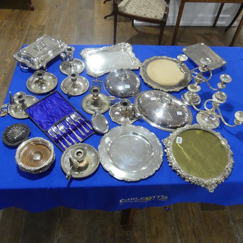 69 - A quantity of Silver Plate, including chamber sticks, entreé dishes, meat plate, candelabra e... 