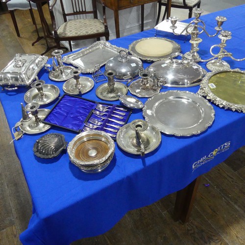 69 - A quantity of Silver Plate, including chamber sticks, entreé dishes, meat plate, candelabra e... 