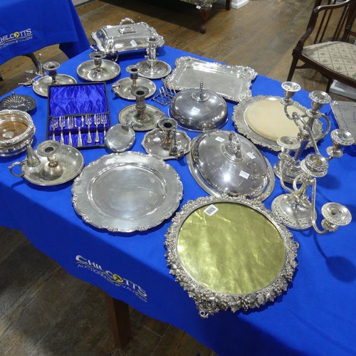 69 - A quantity of Silver Plate, including chamber sticks, entreé dishes, meat plate, candelabra e... 