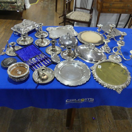 69 - A quantity of Silver Plate, including chamber sticks, entreé dishes, meat plate, candelabra e... 