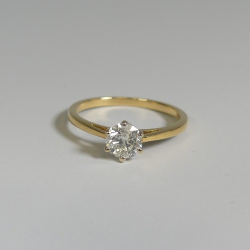 275 - A diamond solitaire Ring, the brilliant cut stone approx. o.62ct, six claw set in 18ct yellow gold, ... 