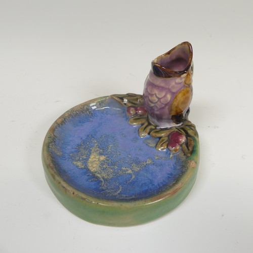 76 - A Doulton Lambeth salt-glazed Bibelot, modelled as a Sparrow Chick with its beak agape, perched at t... 