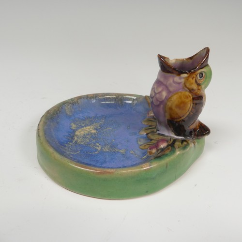 76 - A Doulton Lambeth salt-glazed Bibelot, modelled as a Sparrow Chick with its beak agape, perched at t... 