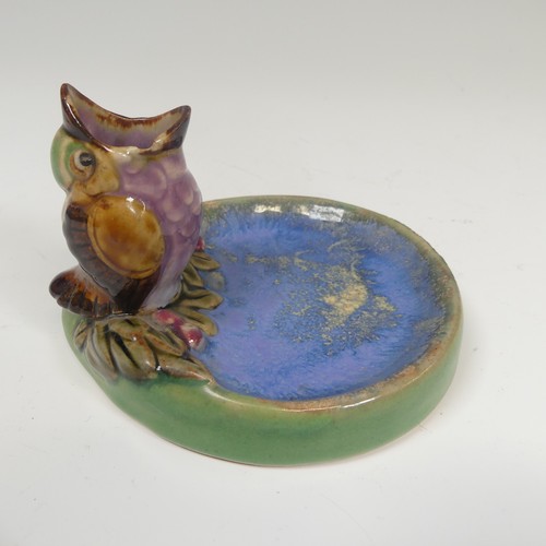 76 - A Doulton Lambeth salt-glazed Bibelot, modelled as a Sparrow Chick with its beak agape, perched at t... 