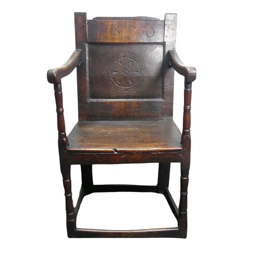 320 - A Charles II Wainscot Chair of joint construction, the top rail carved '1670' above simple carved pa... 