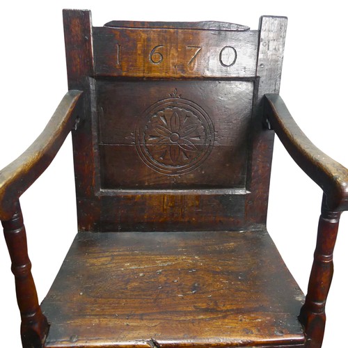 320 - A Charles II Wainscot Chair of joint construction, the top rail carved '1670' above simple carved pa... 