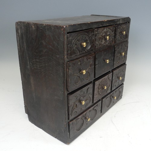 422 - An 18th century elm spice Chest, carved with stylised foliate work and dated '1692', W 39.5 cm x H 3... 