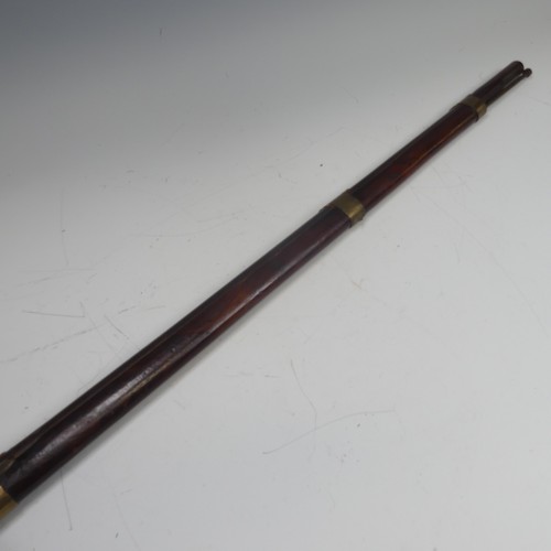 32 - A 19th century matchlock Musket, the steel muzzle and barrel with brass straps, barrel stamped with ... 