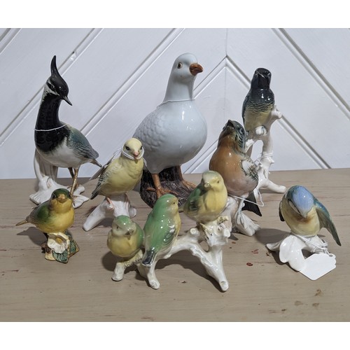 110 - A collection of six continental porcelain bird studies by Karl Ens, together with a Beswick greenfin... 