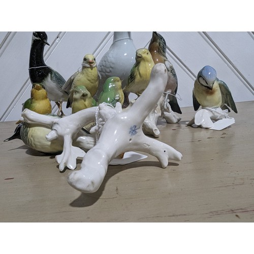 110 - A collection of six continental porcelain bird studies by Karl Ens, together with a Beswick greenfin... 