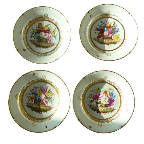 111 - Attributed to Nantgarw: a set of four circular porcelain plates, each painted with a basket of flowe... 