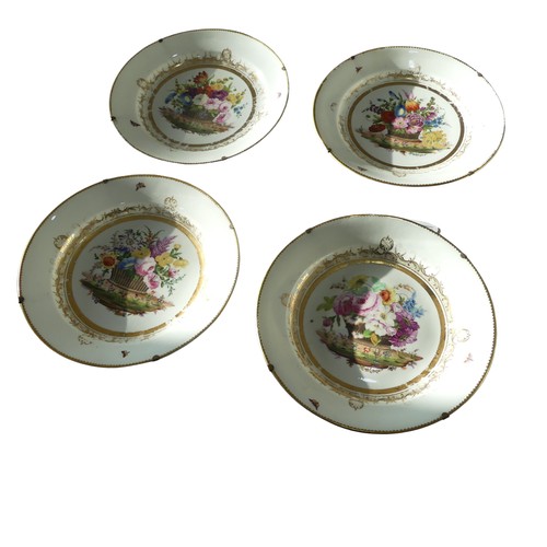 111 - Attributed to Nantgarw: a set of four circular porcelain plates, each painted with a basket of flowe... 