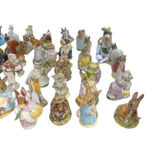 112 - A large collection of Beswick Beatrix Potter Figures, to comprise Pig-Wig, Sally Henny Penny, Anna M... 