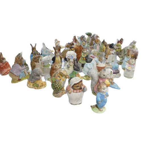 112 - A large collection of Beswick Beatrix Potter Figures, to comprise Pig-Wig, Sally Henny Penny, Anna M... 