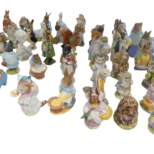 112 - A large collection of Beswick Beatrix Potter Figures, to comprise Pig-Wig, Sally Henny Penny, Anna M... 