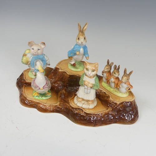 112 - A large collection of Beswick Beatrix Potter Figures, to comprise Pig-Wig, Sally Henny Penny, Anna M... 