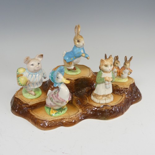 112 - A large collection of Beswick Beatrix Potter Figures, to comprise Pig-Wig, Sally Henny Penny, Anna M... 