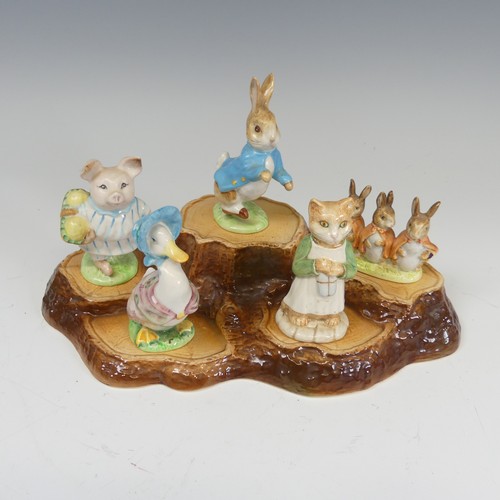 112 - A large collection of Beswick Beatrix Potter Figures, to comprise Pig-Wig, Sally Henny Penny, Anna M... 