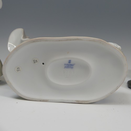 117 - A Lladro porcelain 'Japonesita Sombrero' Figure, no.4988, together with 'A Clean Sweep', 'Summer on ... 