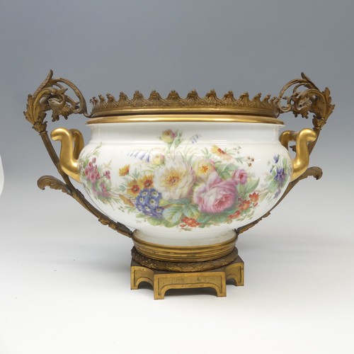 120 - A Sevres porcelain Chateau de Fontainebleau ormolu mounted Centrepiece, the twin handled Bowl with h... 