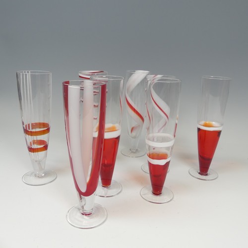 125 - A set of eight modern Flutes by Guzzini, of stylish design, each one decorated with reds and whites ... 