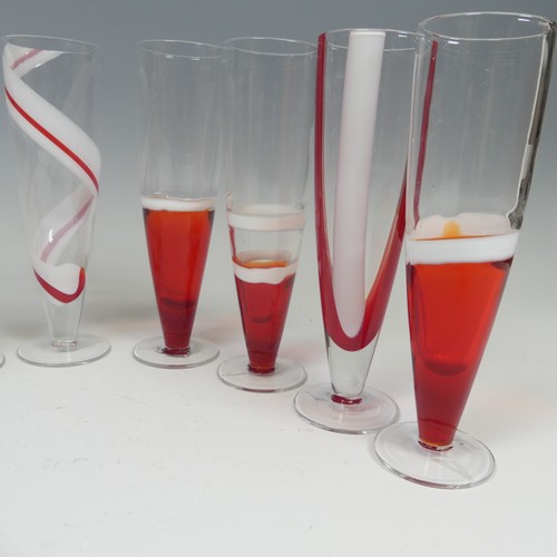 125 - A set of eight modern Flutes by Guzzini, of stylish design, each one decorated with reds and whites ... 