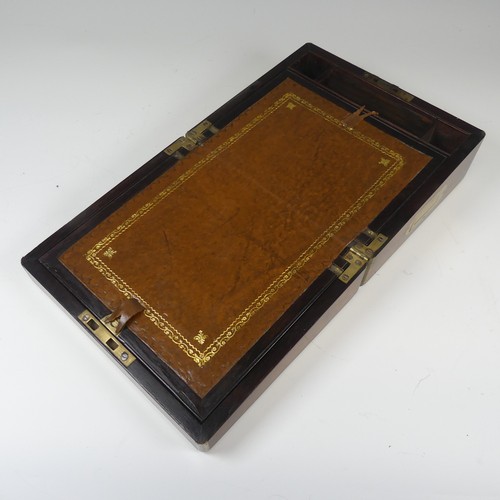 348 - A 19th century mahogany and brass bound campaign writing Slope, of small proportions, hinged top con... 