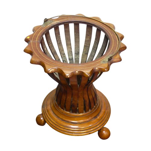 349 - An Edwardian mahogany Regency inspired Planter, with slatted circular base, raised on four rounded f... 