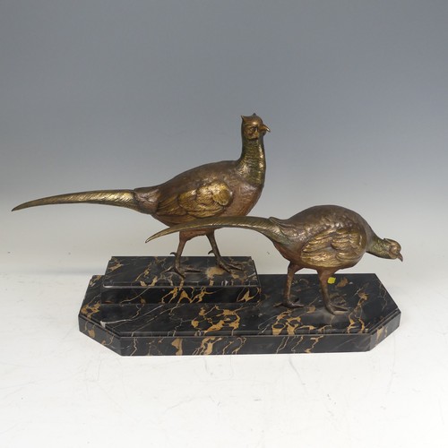 283 - An Art Deco gilt bronze Centrepiece modelled as a pair of Pheasants, signed 'I Gallo', on a stepped ... 